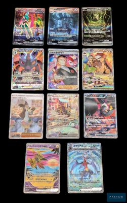gros plan d'une collection de cartes pokemon sur une table