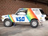 a white van with a rainbow painted on the side of it