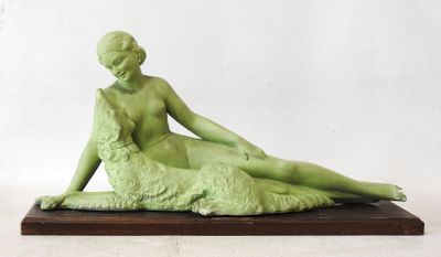 statue of a woman with a dog on a wooden base