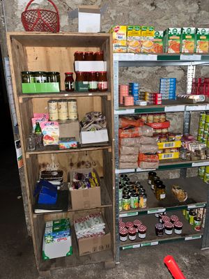 many shelves of food and drinks in this room