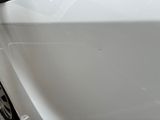 a close up of a car ' s front bumper and fender