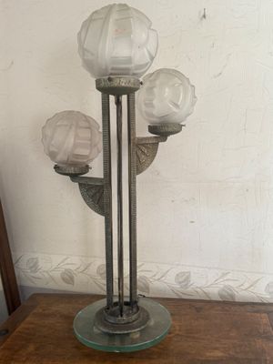 a lamp that is on top of a wooden table