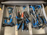 a lot of tools that are in a drawer