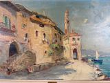 a painting on the wall of a building by the water