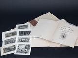 un livre ouvert posé au sommet d'une pile de vieux livres