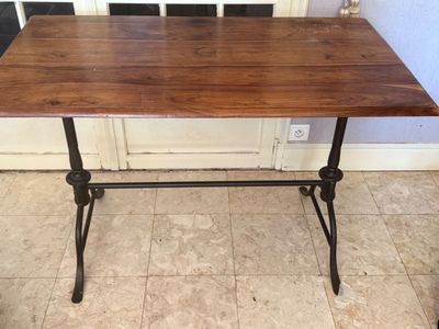 an image of a wooden table with metal legs