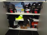 a shelf with a lot of shoes and other items on it