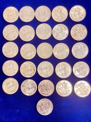 a pile of silver coins sitting on top of a blue surface