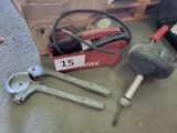 a box of tools sitting on the floor next to a box of tools