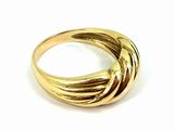 a close up of a gold ring on a white surface