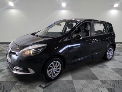 a picture of a black car parked in a garage