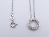two silver necklaces with diamonds on a white background