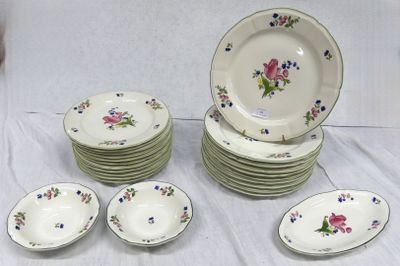 many plates and bowls that are sitting on a table