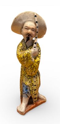 CHINE. Pêcheur à grès émaillé polychrome, un poisson sur son…