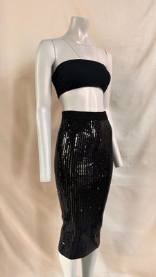 a black sequinized skirt and cropped top on a mannequin mannequin mannequin mannequin mannequin mannequin manne