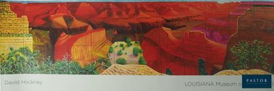a picture of a painting of a desert scene on the wall