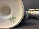 a white porcelain bowl and a white porcelain bowl on a table