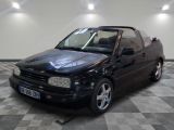 a black car that is parked on a checkered floor