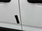 a close up of a car door with a sticker on it