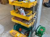a stack of tools on a cart in a garage