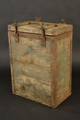 an old wooden box with a latch on the top of it