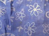a close up of a piece of fabric with a flower design on it