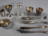 a lot of silver items that are on a table