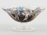 a glass bowl filled with rocks and sea shells