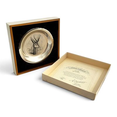 a box with a clock inside of it on a white surface