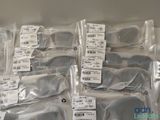 many bags of glasses that are sitting on a table