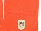 an image of a pair of orange pants with a logo on the side