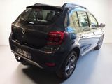 a black car that is parked in a white room