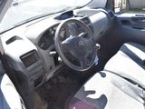 a car with a steering wheel and a dash board
