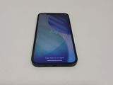 the back of a black samsung galaxy s9 phone sitting on a white surface