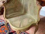a chair that is sitting on a rug in a room