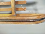 a wooden sled with a sled on top of it