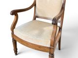 an image of a wooden chair with a beige upholstered seat
