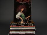 books stacked on top of each other on a black surface