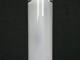 a clear glass bottle with a metal stopper on a black background