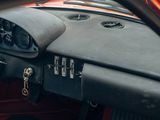 a dashboard of a car with a steering wheel and a clock on it