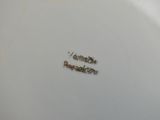a close up of a white plate with writing on it