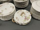 a lot of plates that are sitting on a table