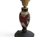 an image of a vase on a stand with a flower design on it
