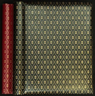 trois livres dans un cadre noir, aux couvertures dorées et rouges