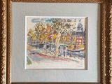 framed painting of a street scene with trees and buildings in the background
