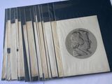 several books with a drawing of a man on them on a table