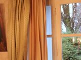 a picture of a bedroom with a bed and a window
