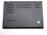 a black laptop with a blue sticker on it
