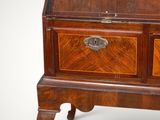 an old wooden desk with a drawer on top of it