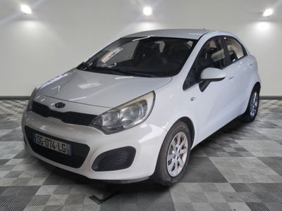 a picture of a white car parked in a garage